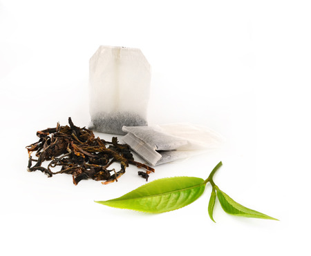 Green tea leaf isolated on white backgroundの写真素材