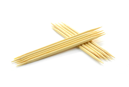 Bamboo toothpicks isolated on white backgroundの写真素材
