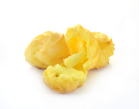 Cream puffs on white background
