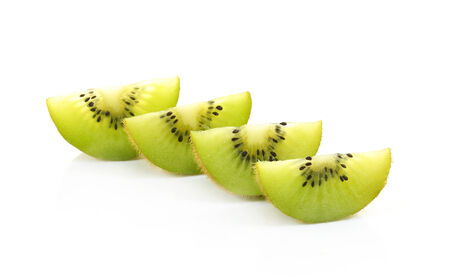 Whole kiwi fruit and his sliced segments isolated on white background の写真素材