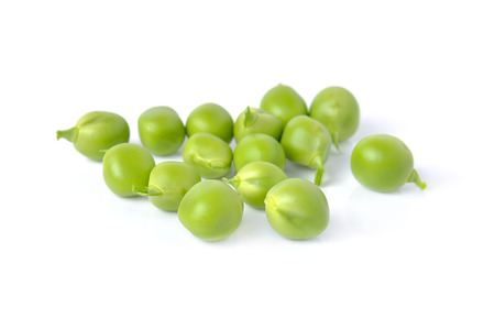 fresh peas isolated on white backgroundの写真素材
