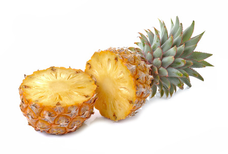 Juicy ripe sliced pineapple isolated on white backgroundの写真素材