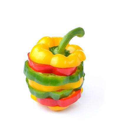 red, green and yellow sliced pepper isolated on white backgroundの写真素材