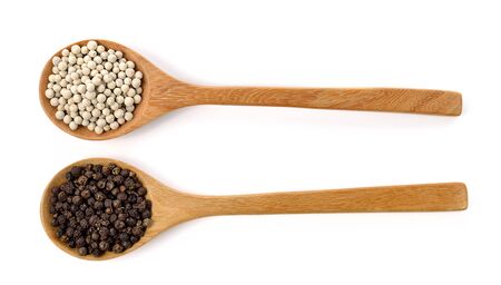 Wooden spoons and peppercorn on white backgroundの写真素材
