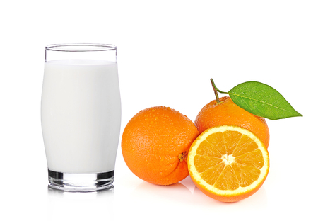 Fresh Glass of Milk and Half of juicy orange isolated on white backgroundの写真素材
