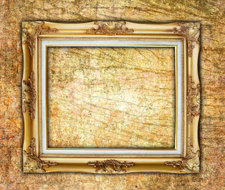 Old picture frame on wall.の写真素材