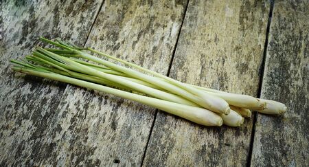 Lemon grass on wooden surface.の写真素材