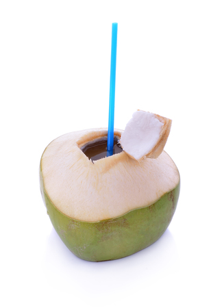 Green coconuts with drinking straw isolatedの写真素材