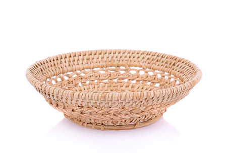 vintage weave wicker basket isolated on white backgroundの写真素材