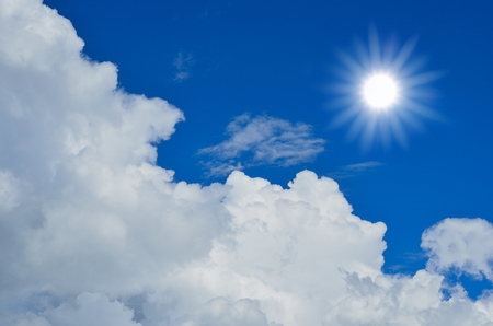 Blue sky with clouds and sun.の写真素材