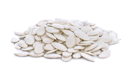 Pumpkin seeds on the white backgroundの写真素材