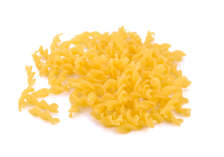raw pasta on a white backgroundの写真素材