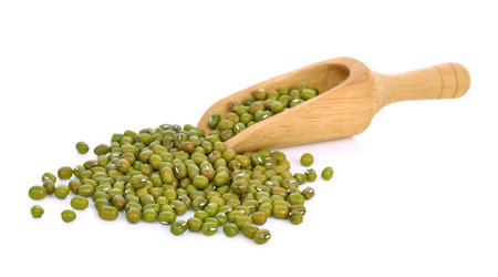 Mung beans on wooden spoon isolated on whiteの写真素材