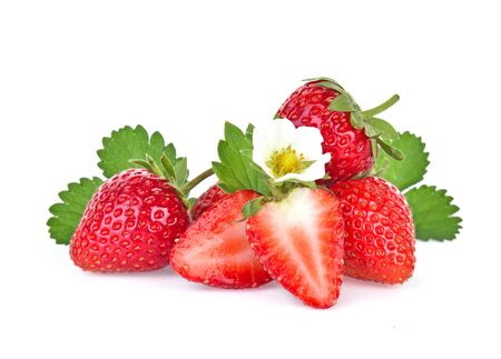 Strawberry plant with leaves, berries and flower, isolated on white background.の写真素材