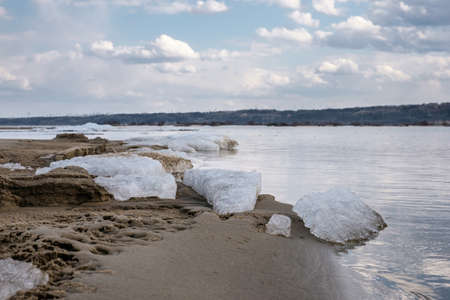 The last ice on the sandy banks of the river in the springの写真素材