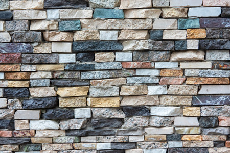 Wall of the facade of a building with decorative finishing. There are many stone details of...