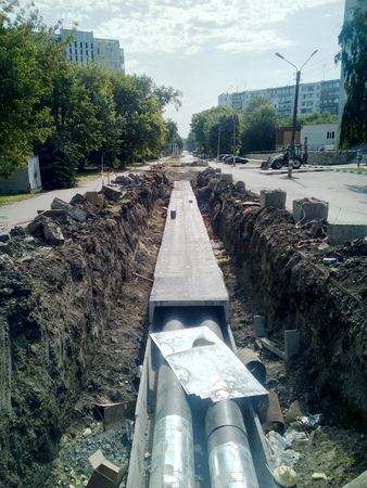 Road repair on the street in the city, closed road for reconstruction, fences,  special equipment, communal city servicesの写真素材