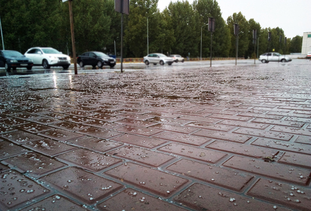hail in the street and parking, the floor is covered with icy hailの写真素材