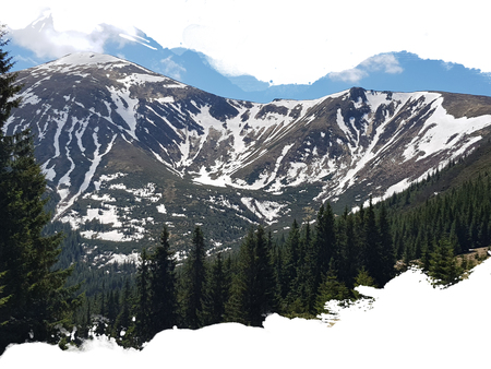 mountain with snowy peaks surrounded by forest and blue sky, stylized watercolor frameの写真素材