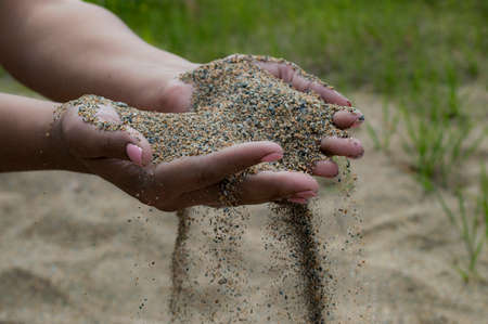 sand falls from hands beautifullyの写真素材