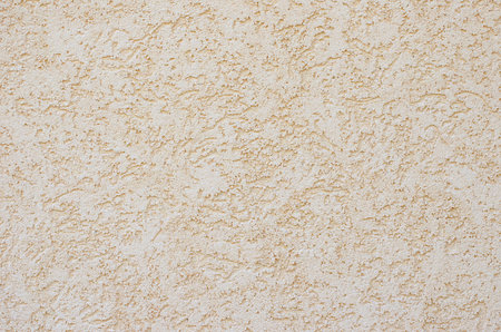 Decorative stucco wall of the house.