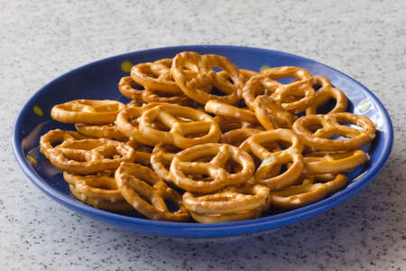 Delicious biscuits on a blue saucer and marble top.の写真素材