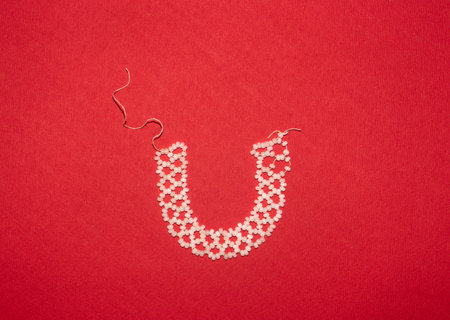 handmade beaded bracelet on color backgroundの写真素材