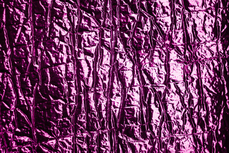 Pink crumpled foil texture background. Abstract backdrop and texture for design.の写真素材