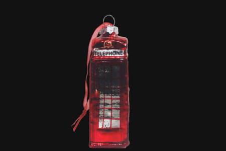 Vintage red telephone isolated on black background with clipping path.の写真素材