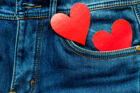two hearts on a background of a jeans pocket close-up.Valentines Day background consept.の写真素材