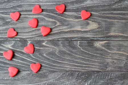 Valentine's Day . Red hearts on a wooden background.の写真素材