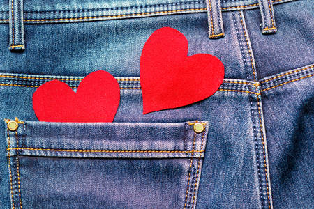 two hearts on a background of a jeans pocket close-up.Valentines Day background consept.の写真素材