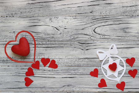 On a wooden background there are many hearts to Valentine's Day. The concept of Valentine's Day.の写真素材