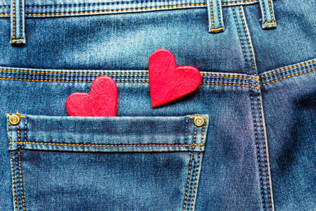 two hearts on a background of a jeans pocket close-up.Valentines Day background consept.の写真素材