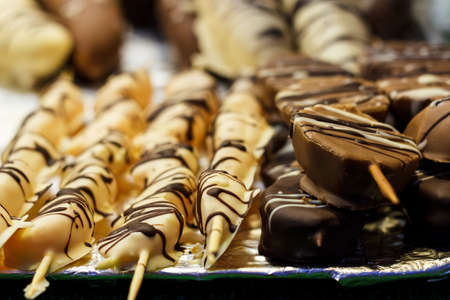 Sweets made in the form of a meat shish kebab on a wooden stick.の写真素材