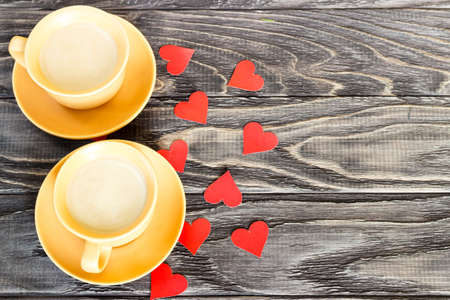 On a wooden background are the hearts with a cup of coffee. Valentine's day concept.の写真素材