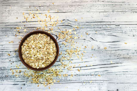 Plate with muesli on a wooden background. Healthy breakfast. Copy space. View from above.の写真素材