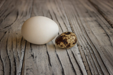 Quail eggs on a wooden table, a symbol of the Easter season. Healthy eating.の写真素材