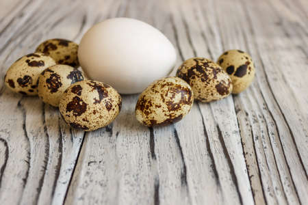 Quail eggs on a wooden table, a symbol of the Easter season. Healthy eating.の写真素材