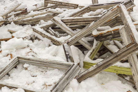 Broken old wooden window frames. Firewood for heating.の写真素材