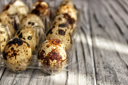 For sale quail eggs in a transparent tray, a tray for storing quail eggs, a symbol for the Easter...