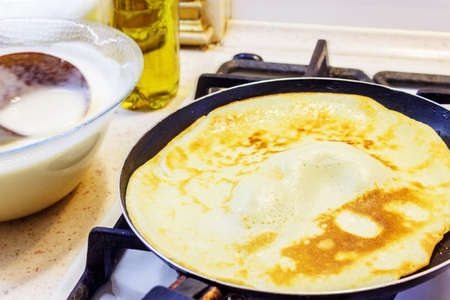 The process of making pancakes in the background milk, eggs, sugar, salt, flour, vegetable oil.の写真素材
