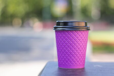 purple paper coffee Cup on the stoveの写真素材