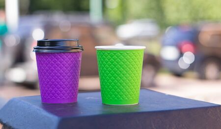 purple and green paper coffee Cup on the stoveの写真素材