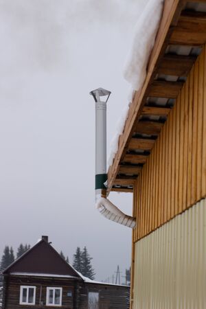 kindling bath in full swing, belching black smoke from the chimney.の写真素材