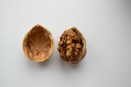 Cracked walnuts isolated on white backgroundの写真素材
