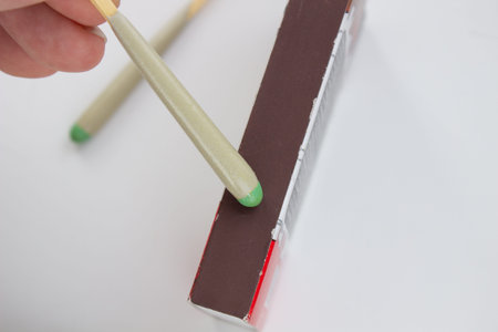 Hunting waterproof matches in a paper box isolated on white background.