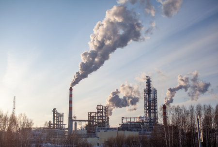 The work of a petrochemical plant. Smoke is coming from the chimney.の写真素材