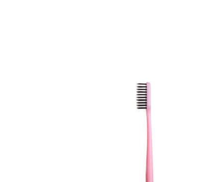 The pink tooth brushing cheek is isolated on a white background. Care and hygiene for the oral cavityの写真素材