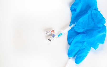 Kemerovo, Russia, July 2021. The coronavirus vaccine is in the hands of a doctor, a syringe. Coronavirus Covid 19 vaccine Sputnik V, local name GamCovidVac, produced in Russia and ready for injectionのeditorial素材